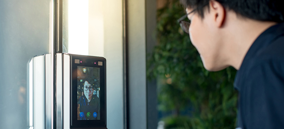 Student scanning his face with biometric system