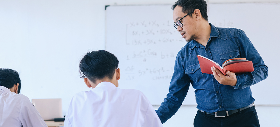 Teacher conducting a lesson with students in a classroom