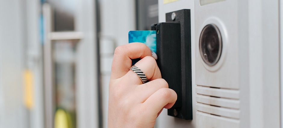 Person using card to access lock system