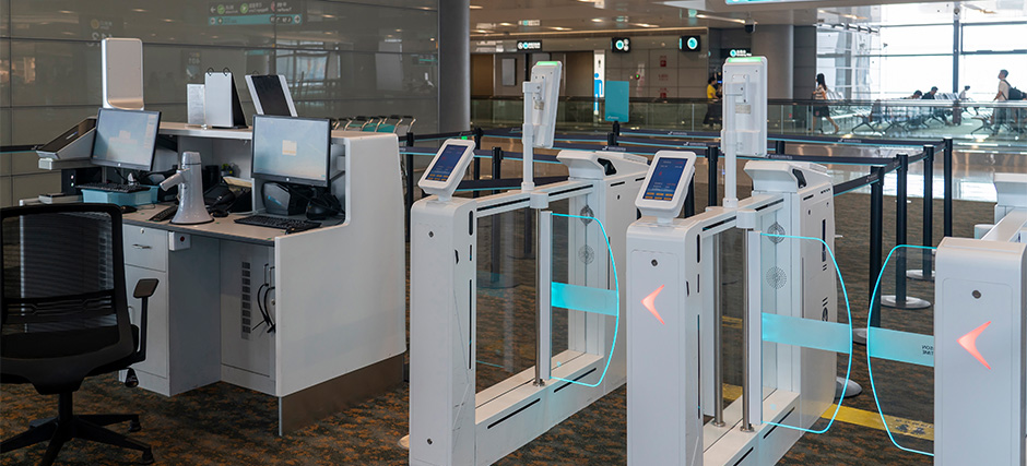 Automated biometric immigration gates at a modern airport terminal.