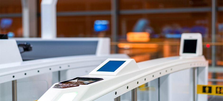 Close-up of immigration automated gate with screens for biometrics.