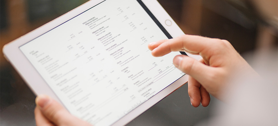 Hands interacting with a digital activity log displayed on a tablet.