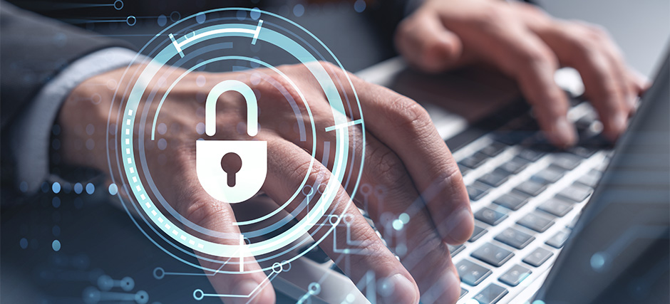Person typing on laptop with digital overlay of open padlock and network graphics symbolizing cybersecurity